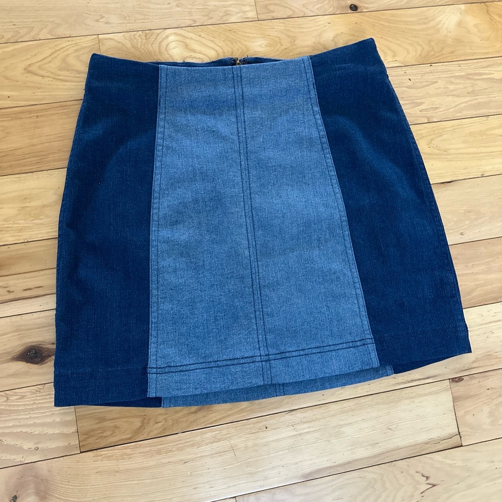 Free People size 6 soft, stretch, zips in back. Two tone denim skirt.